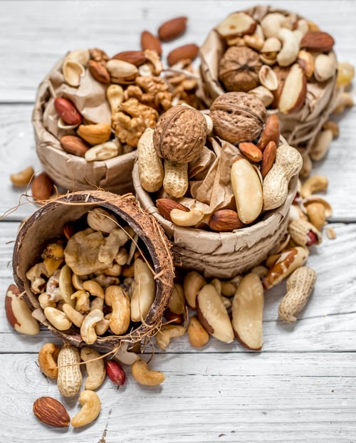 Preview: different nuts in a plate closeup