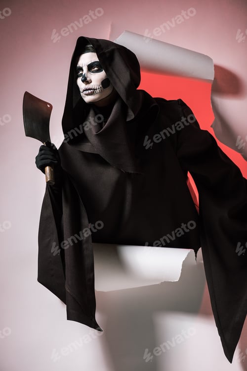 Preview: woman in death costume holding cleaver and getting out of hole in paper