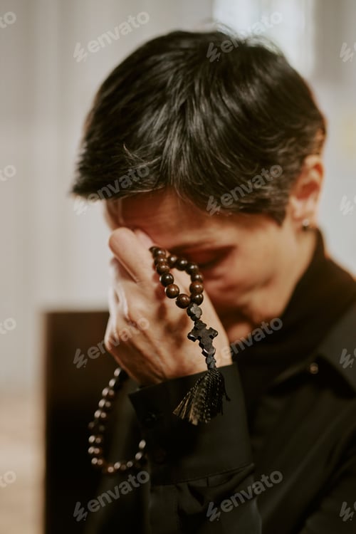 Preview: Sorrowful Woman Holding Rosary