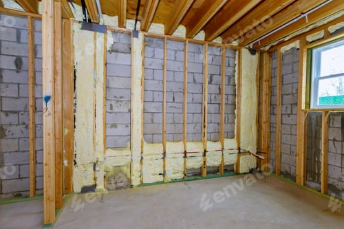 Preview: New wooden house in foam for insulation the wall of a basement unfinished under construction
