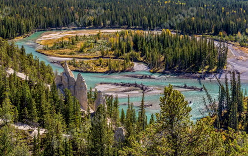 Preview: River and rocky formations among autumn forest