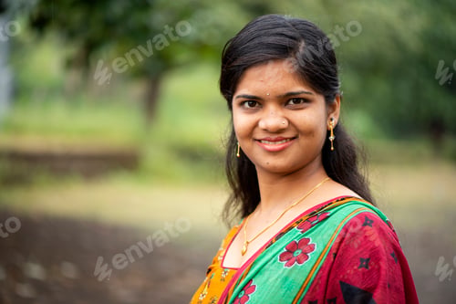 Preview: Happy young beautiful Indian woman at the park outdoor