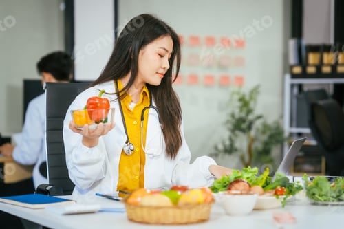 Preview: Two nutritionists,female and male, work in a hospital, analyzing vegetable and fruit salads