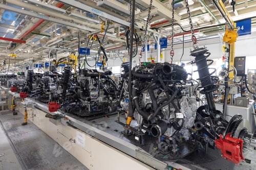 Preview: Photo of automobile production line. Welding car body. Modern car assembly plant. Auto industry
