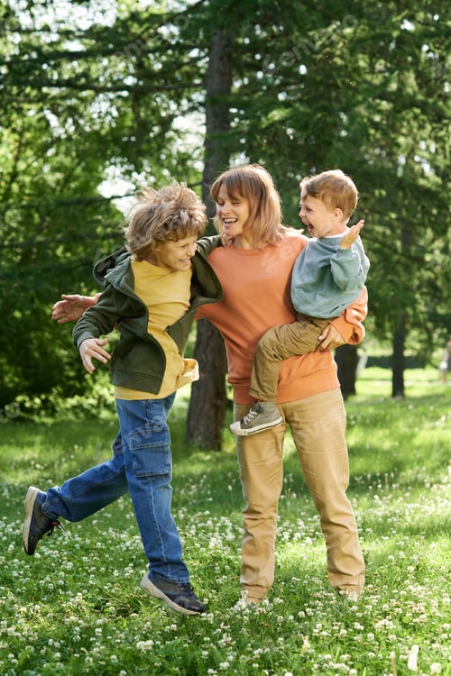 Preview: Boy Jplaying with Mother and Brother in Park