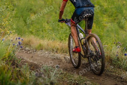 Preview: male mountain bike cyclist riding on cross-country cycling