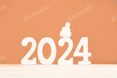 Preview: Wooden numbers 2024 and on a peach background. Festive background.