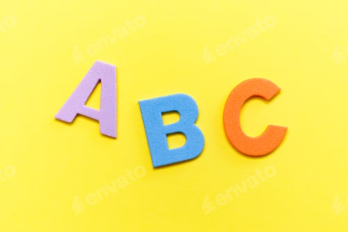 Preview: Back to school concept. Detailed plastic letters on yellow background