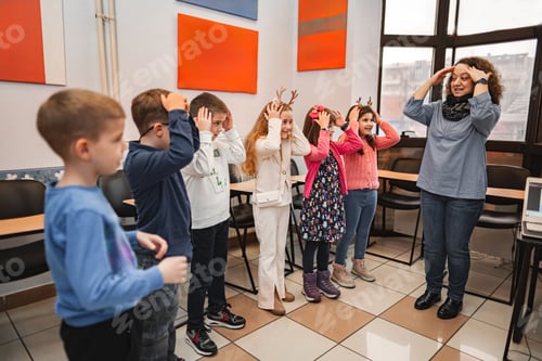 Preview: Woman teaching a group of elementary students body parts at language school