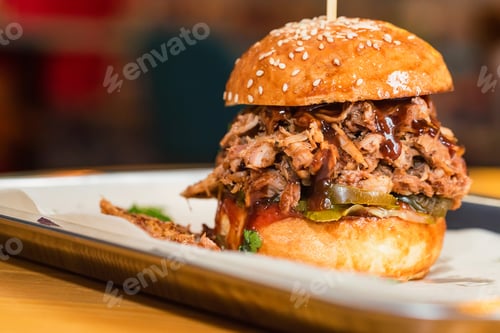 Preview: Close up tasty burger with minced meat served on tray