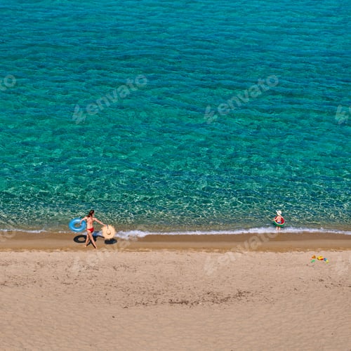 Preview: Toddler boy on beach with mother