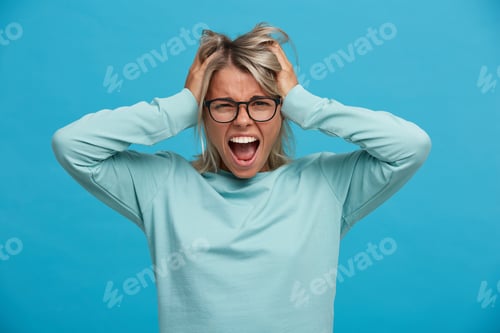Preview: ndoor shoot of funny cheerful glad blonde young girl