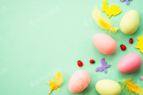 Preview: Easter background with Eggs, rabbit and spring flowers at green background.