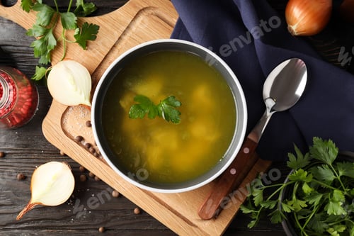 Preview: Concept of tasty food with chicken soup on wooden background