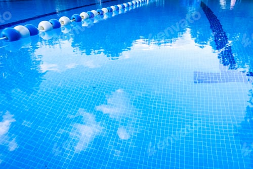 Preview: Detail of the water of a pool with beacons to separate the swimming streets.