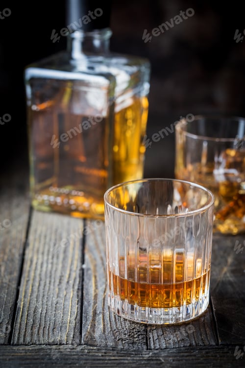 Preview: Glass and a bottle of whiskey