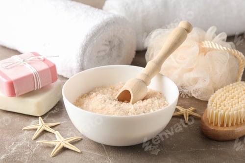Preview: Body care accessories and starfishes on grey background, close up
