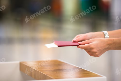 Preview: Closeup passports and boarding pass at airport indoor