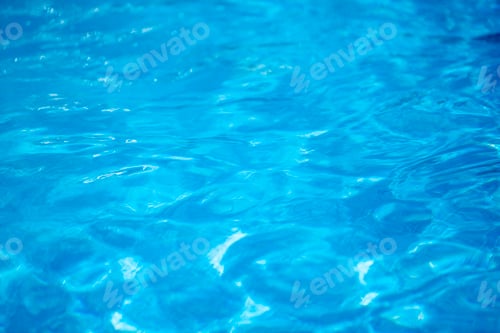 Preview: textured sea water background from azure and light blue sea depths with waves.