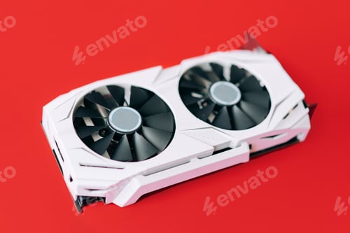Preview: White graphics card with two black fans is located in the middle of red background. Trending