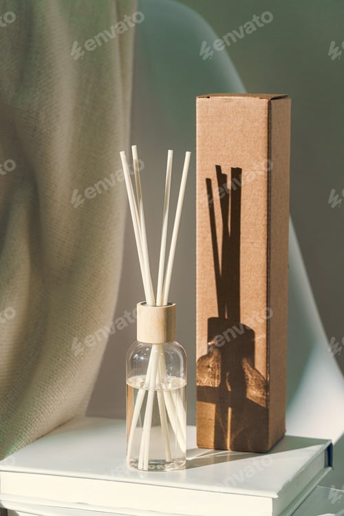 Preview: Liquid home perfume in glass diffuser with sticks on chair