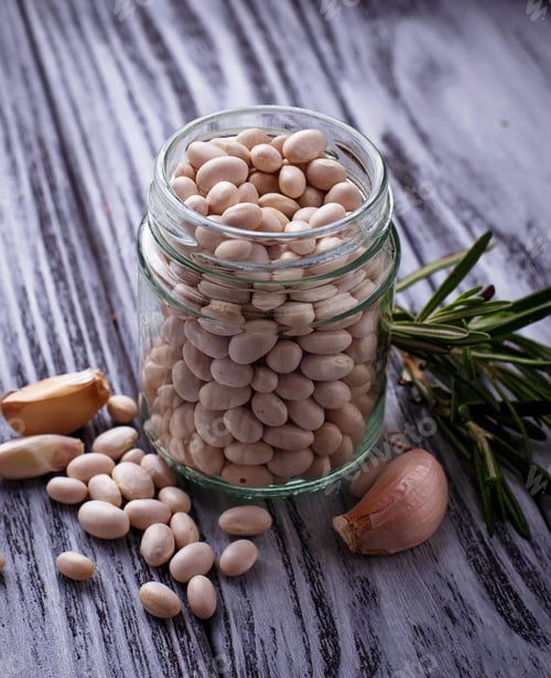 Preview: White dry beans in jar.