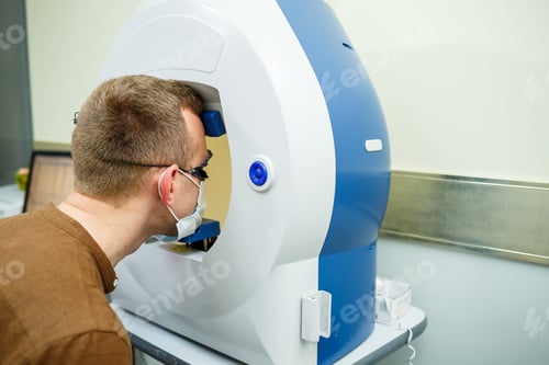 Preview: Professional medical equipment scanning the patient's eyes. The device of a modern healthcare clinic