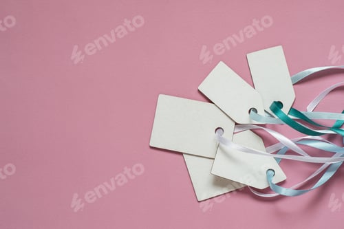 Preview: Blank paper price sale tags On pink background
