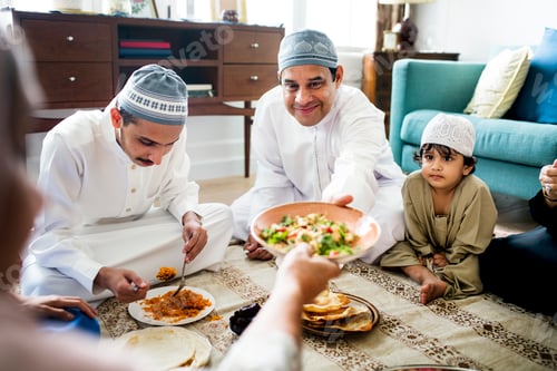 Preview: Muslim family having dinner on the floor