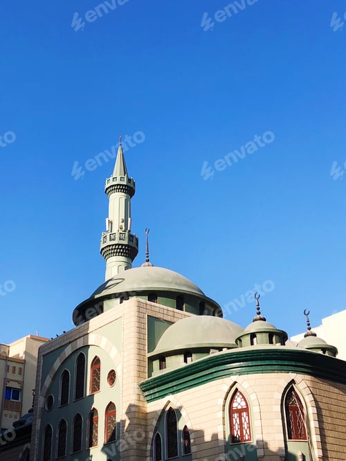 Preview: Green mosque against blue sky