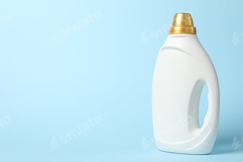 Preview: Bottle of fabric softener on light blue background, space for text