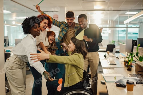 Preview: Business woman with disability celebrating birthday with diverse colleagues