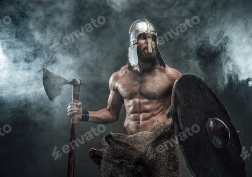 Preview: Armoured and naked viking posing with axe and shield in smoke