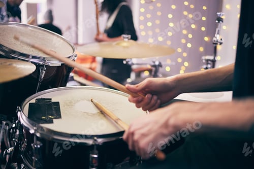 Preview: Time to jam out. Shot of an unrecognizable drummer playing drums during a band practice at home.