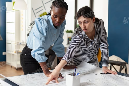 Preview: Architectural team of multi ethnic women plan sketch