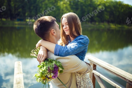 Preview: Couple in love enjoying tender moments during sunset .