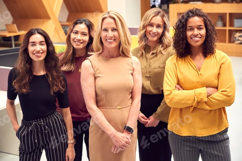 Preview: Portrait Of Multi-Cultural Female Business Team Standing In Modern Open Plan Office