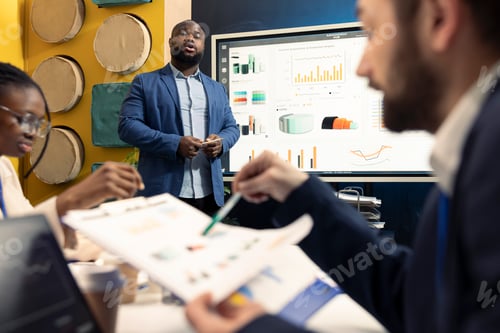 Preview: African american office manager providing important information