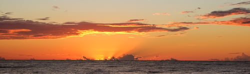 Preview: sunset ,sunrise on the beach. beautiful summer scenery. rocks on the sand. calm waves on the water.