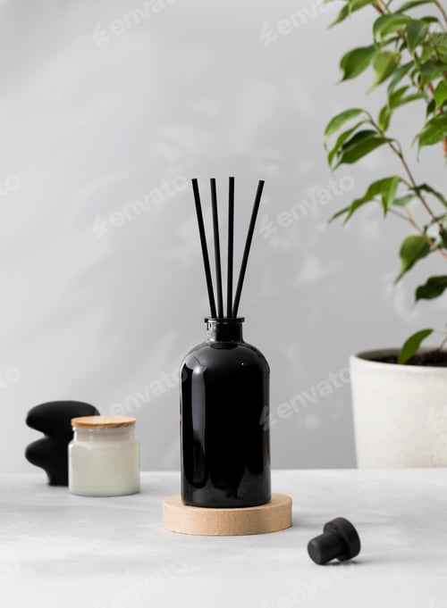 Preview: Bamboo sticks in a black bottle with indoor perfumes. Glass diffuser with fragrance for home.