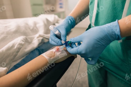 Preview: Venous access being established in a patient’s hand by a medical professional