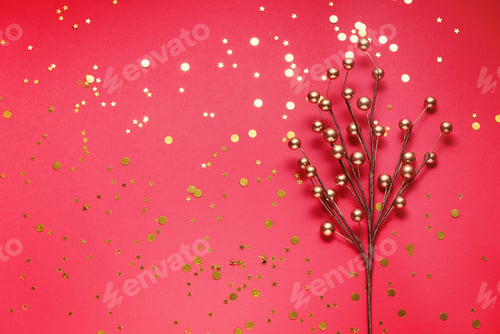 Preview: photoGolden branch christmas decoration with sparkles on red festive background