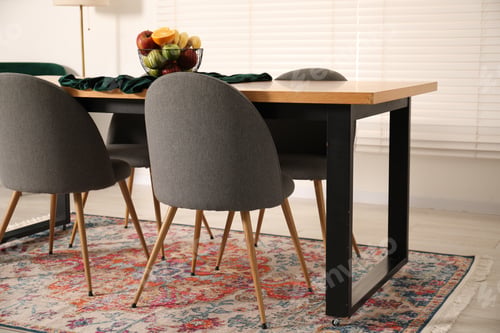 Preview: Bowl of fruits on wooden table in dining room. Interior design