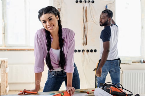 Preview: happy young couple making renovation of home
