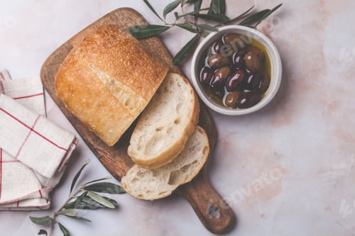 Preview: Natural kalamata olives in oil with spices and fresh ciabatta. Mediterranean food concept.