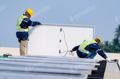 Preview: workers installing solar panels, for efficient energy on rooftop