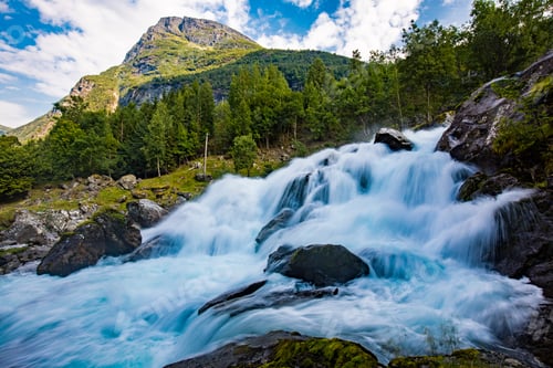 Preview: View of the river Geirangerelvi and the waterfall Storfossen in Geiranger, Norway.