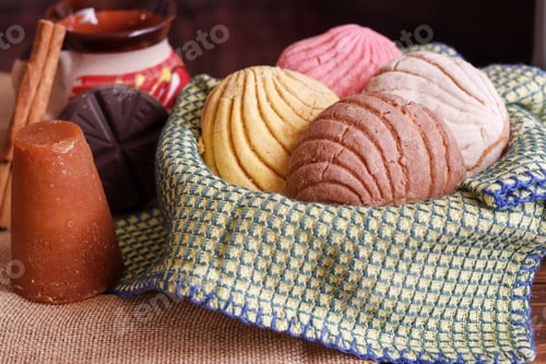 Preview: Closeup shot of Mexican bread and a Mexican mug with chocolate