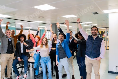 Preview: Cheerful office team celebrating success.