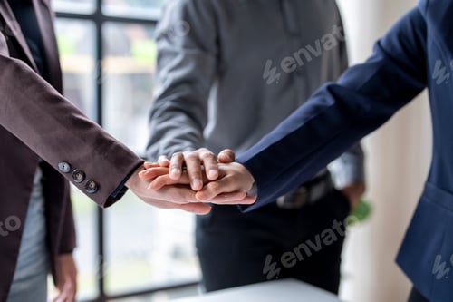 Preview: Business team joining hands for teamwork and cooperation concept